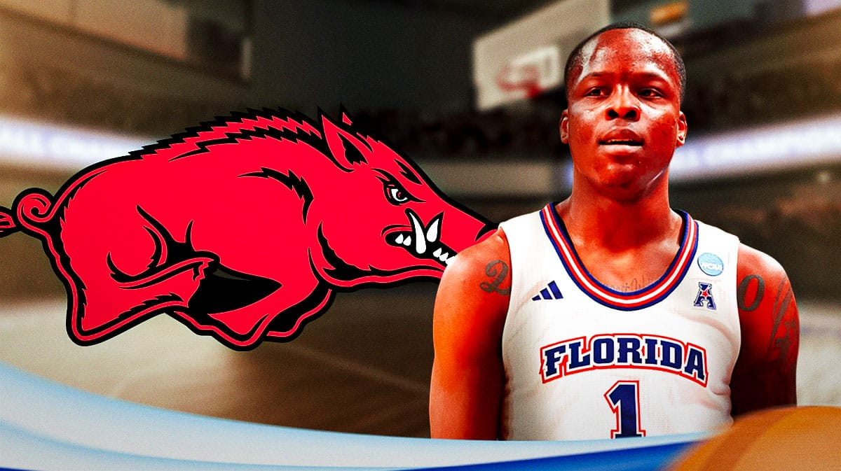 Johnell Davis stands next to Arkansas basketball logo, John Calapiri after NBA Draft workouts