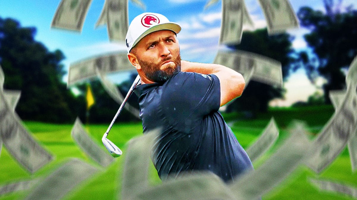 Photo: Jon Rahm with money flying around him in action