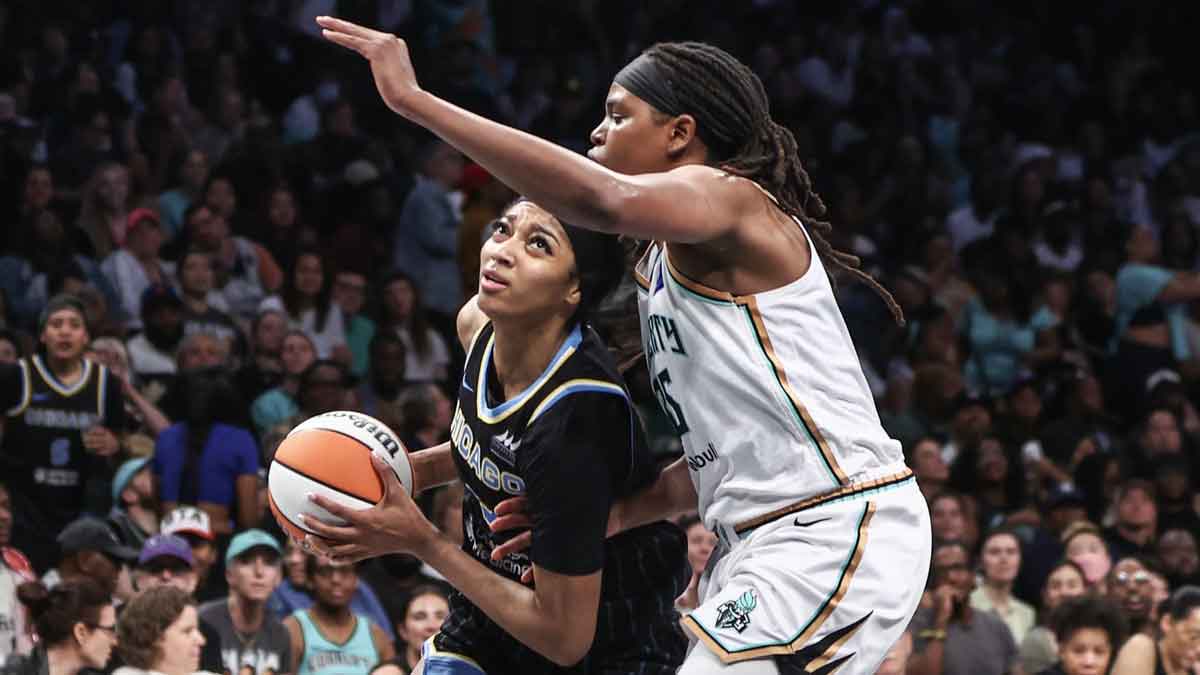 May 23, 2024; Brooklyn, New York, USA; Chicago Sky forward Angel Reese (5) drives past New York Liberty forward Jonquel Jones (35) in the fourth quarter at Barclays Center.