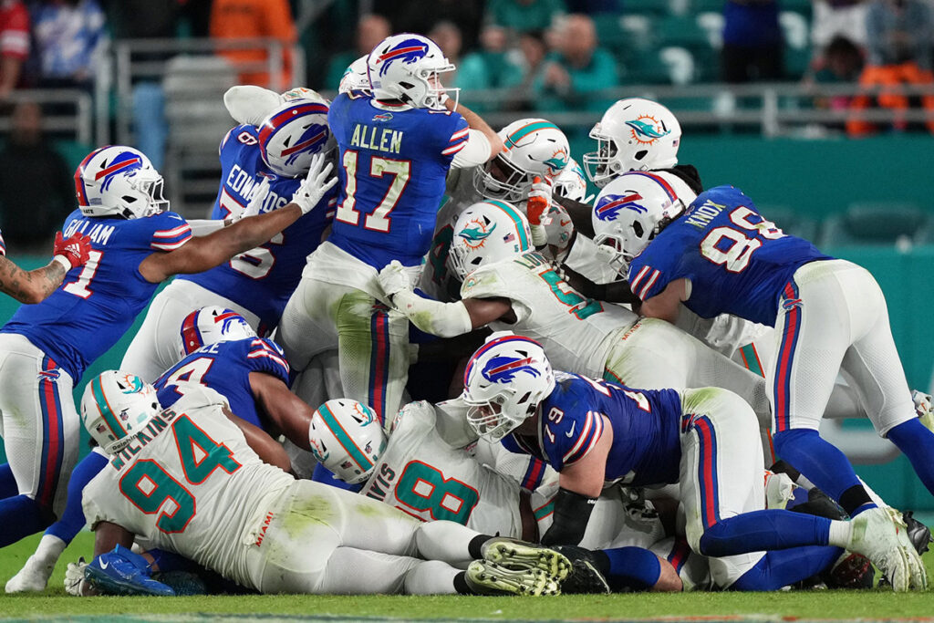 Buffalo Bills quarterback Josh Allen pushing the ball ahead against the Miami Dolphins
