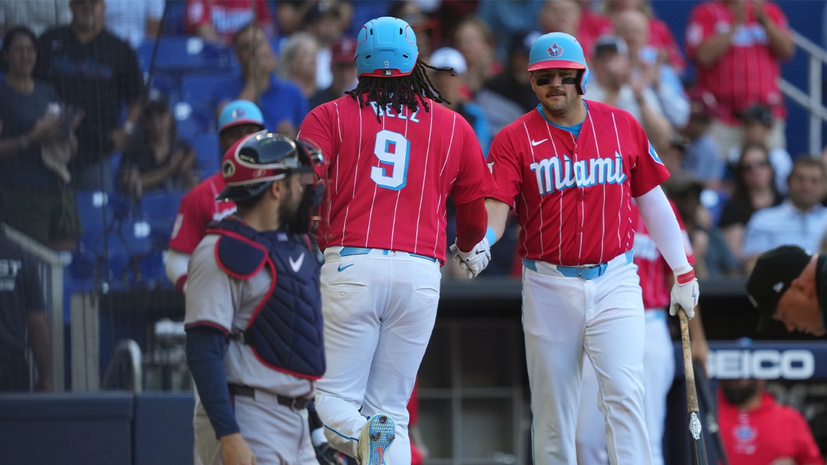 Miami Marlins designated hitter Josh Bell (9) is congratulated by first baseman Jake Burger (36) after hitting a home run in the first inning at loanDepot Park.