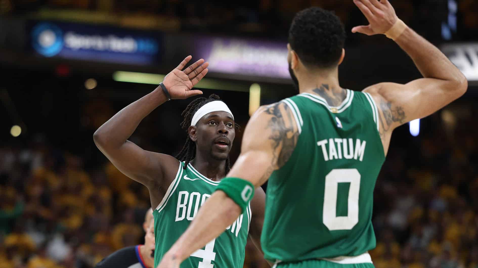 Boston Celtics guard Jrue Holiday (4) celebrates with forward Jayson Tatum (0) after drawing a foul against the Indiana Pacers in the closing seconds of the fourth quarter of game three of the eastern conference finals in the 2024 NBA playoffs at Gainbridge Fieldhouse