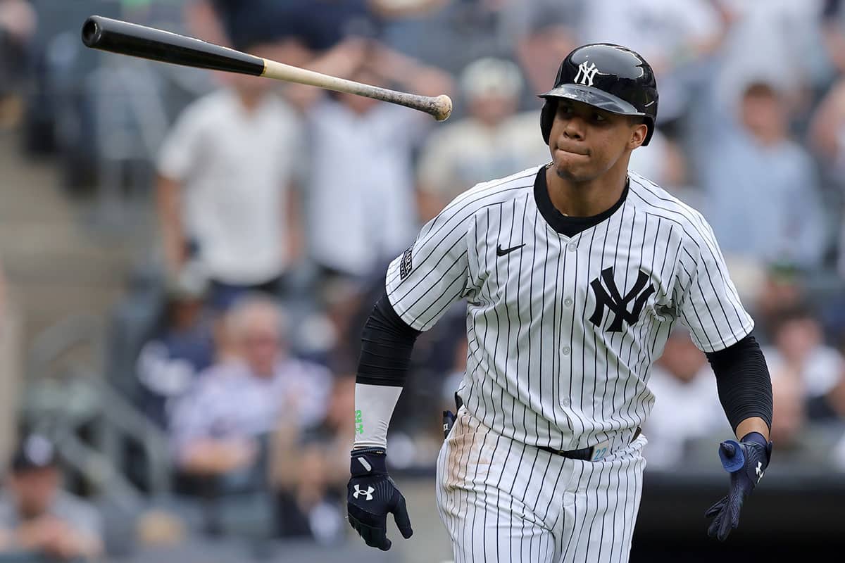 New York Yankees right fielder Juan Soto (22) flips his bat after hitting a solo home run against the Chicago White Sox during the fifth inning at Yankee Stadium.