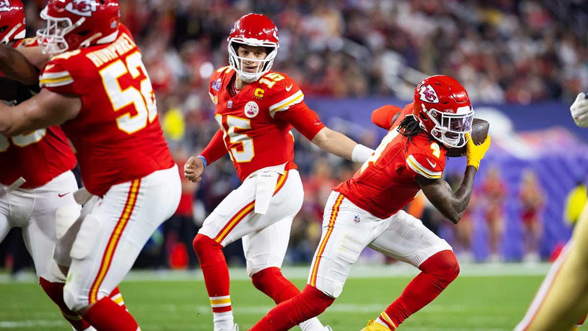 Kansas City Chiefs quarterback Patrick Mahomes (15) hands off the ball to wide receiver Rashee Rice (4) against the San Francisco 49ers during Super Bowl LVIII at Allegiant Stadium.