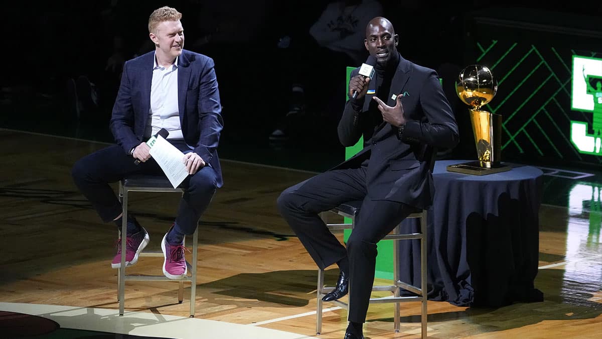 Mar 13, 2022; Boston, Massachusetts, USA; Basketball Hall of Fame and former Boston Celtic, Kevin Garnett speaks with Brian Scalabrine during the number retirement ceremony after the game between the Boston Celtics the Dallas Mavericks at TD Garden.