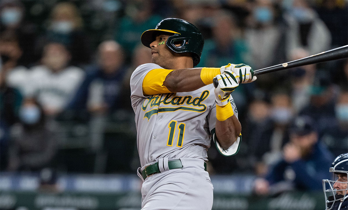 Oakland Athletics designated hitter Khris Davis (11) takes a swing during an at-bat in a game against the Seattle Mariners at T-Mobile Park. The Mariners won 13-4.