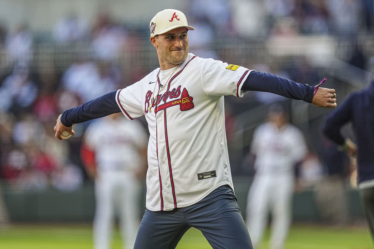 Atlanta Falcons quarterback Kirk Cousins throws out the first pitch prior to the game between the Atlanta Braves against the Texas Rangers at Truist Park.