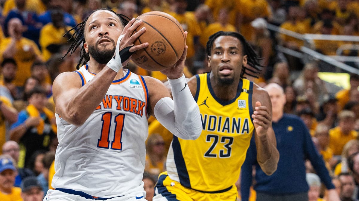 New York Knicks guard Jalen Brunson (11) shoots the ball while Indiana Pacers forward Aaron Nesmith (23) defends during game six of the second round for the 2024 NBA playoffs at Gainbridge Fieldhouse. 