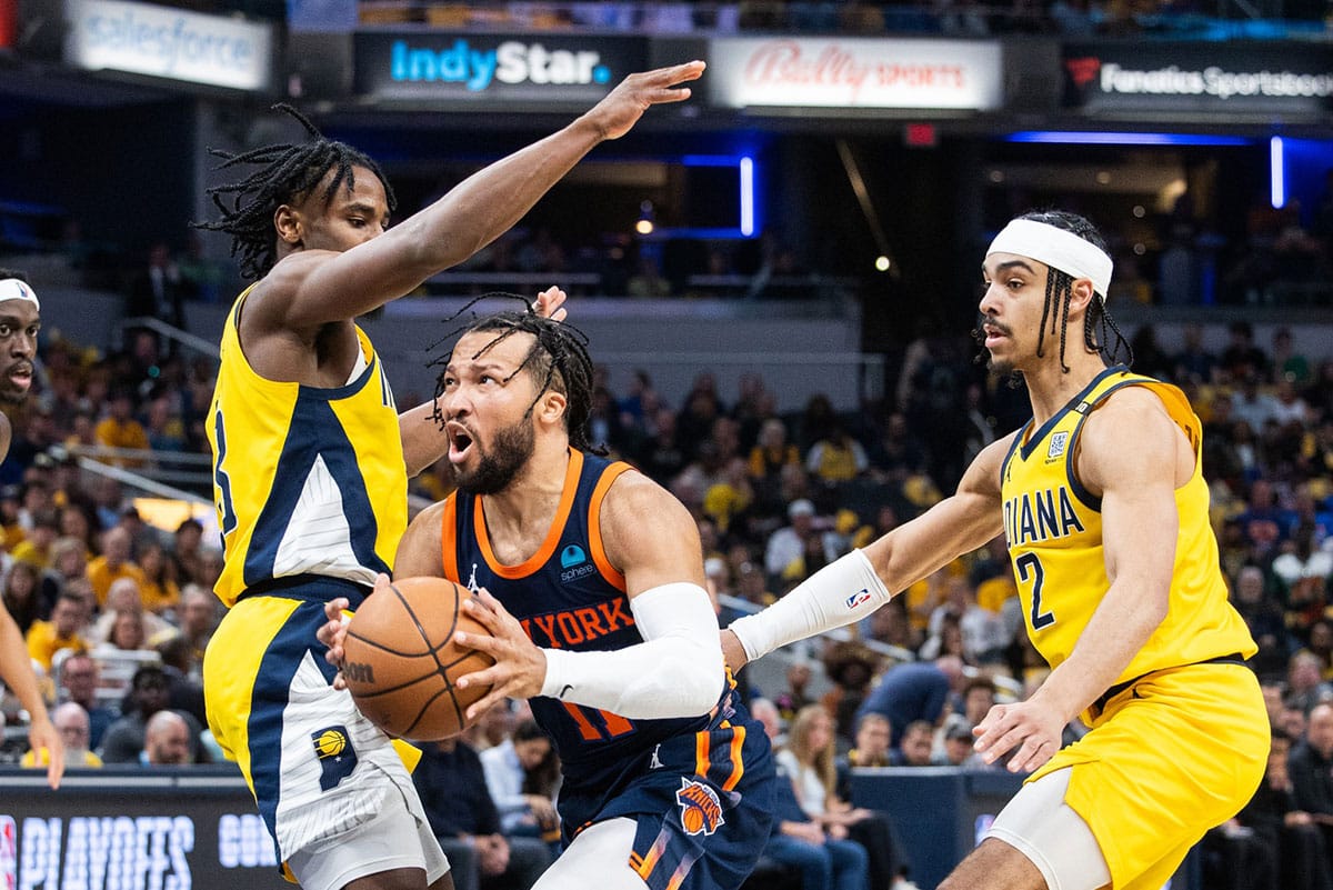 New York Knicks guard Jalen Brunson (11) shoots the ball while Indiana Pacers forward Aaron Nesmith (23) defends during game four of the second round for the 2024 NBA playoffs at Gainbridge Fieldhouse.