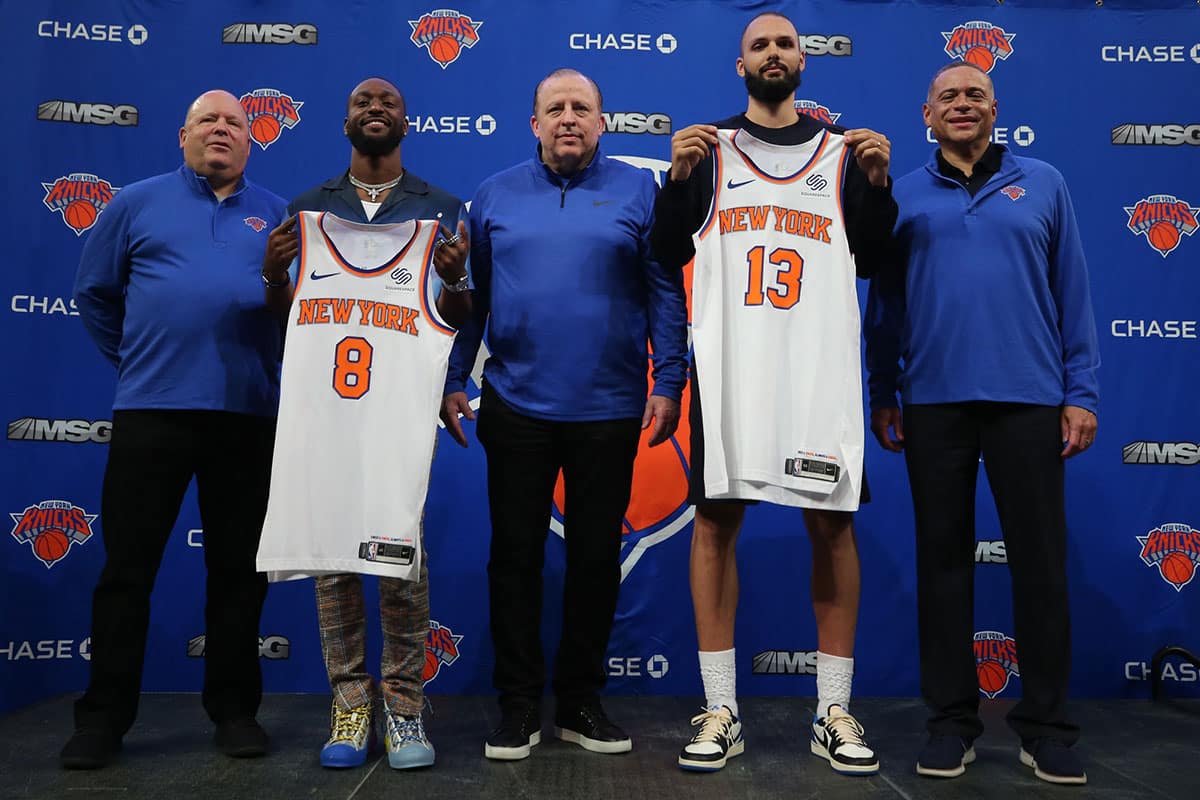 New York Knicks guard Kemba Walker (8) and guard Evan Fournier (13) pose for a photo with team president Leon Rose (left) and head coach Tom Thibodeau (middle) and general manager Scott Perry (right) during their introductory press conference at Madison Square Garden. 