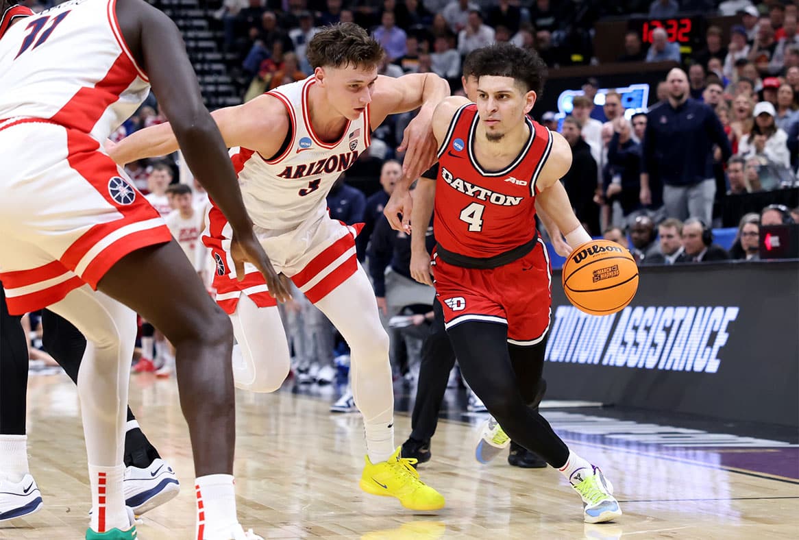 Dayton Flyers guard Koby Brea (4) drives against Arizona Wildcats guard Pelle Larsson (3) during the second half in the second round of the 2024 NCAA Tournament at Vivint Smart Home Arena-Delta Center. 