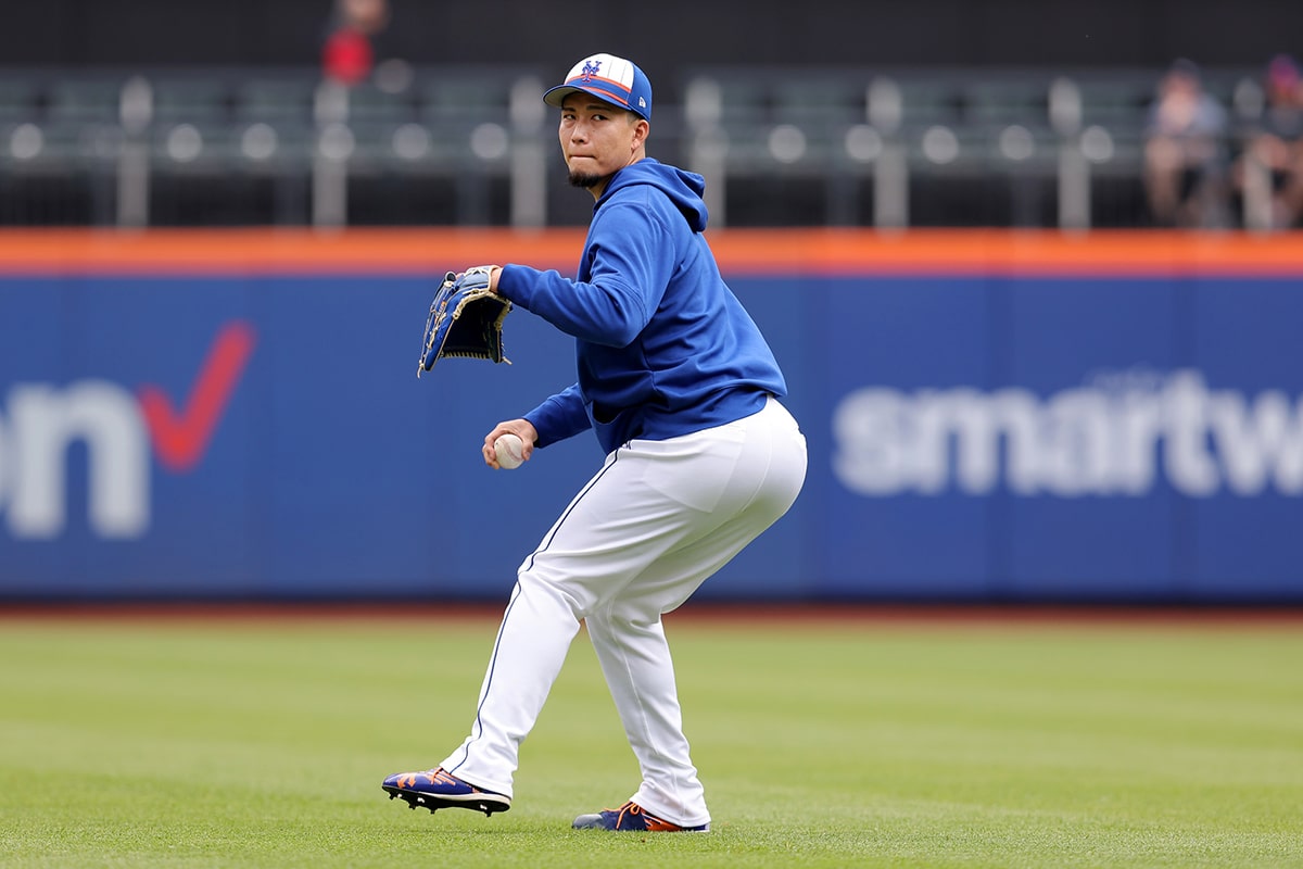 New York Mets injured pitcher Kodai Senga (34) throws in the outfield before a game against the Philadelphia Phillies at Citi Field.
