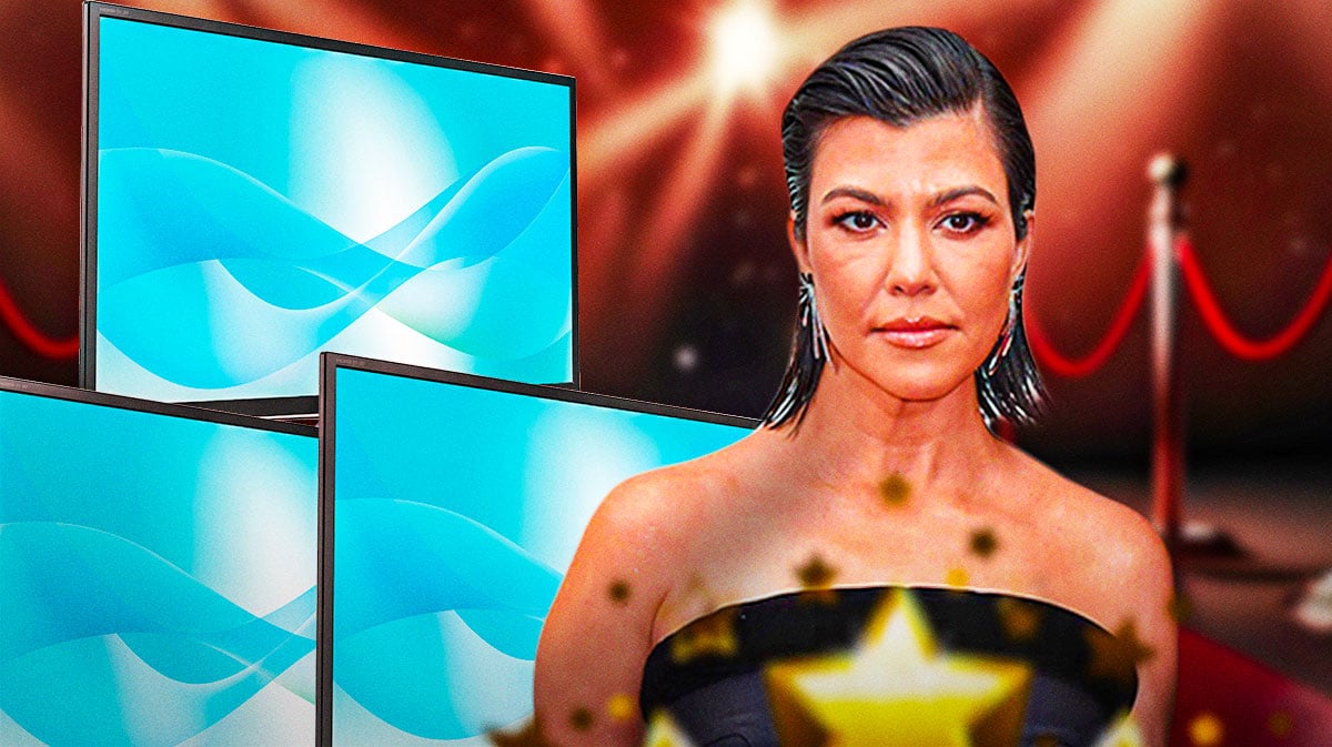 Kourtney Kardashian with tvs behind her and a red carpet
