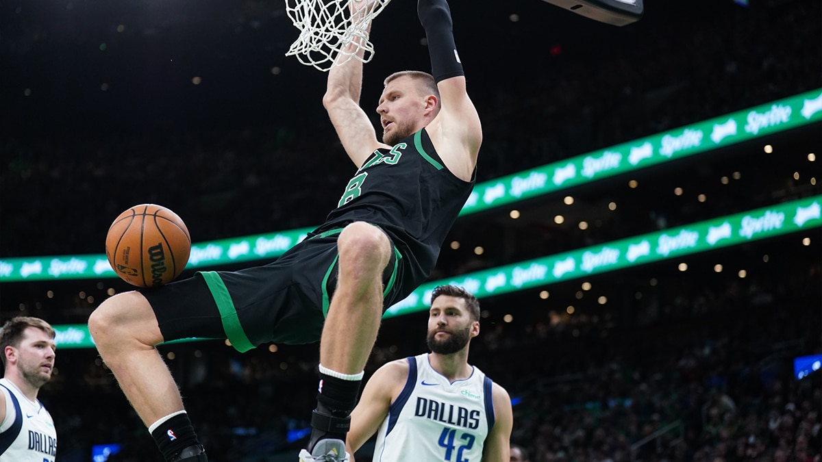 Boston Celtics center Kristaps Porzingis (8) makes the basket against the Dallas Mavericks in the second half at TD Garden.