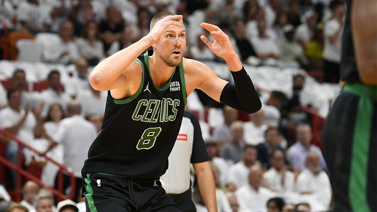 Boston Celtics center Kristaps Porzingis (8) reacts to a foul call while playing the Miami Heat during the first quarter of game four of the first round for the 2024 NBA playoffs at Kaseya Center.