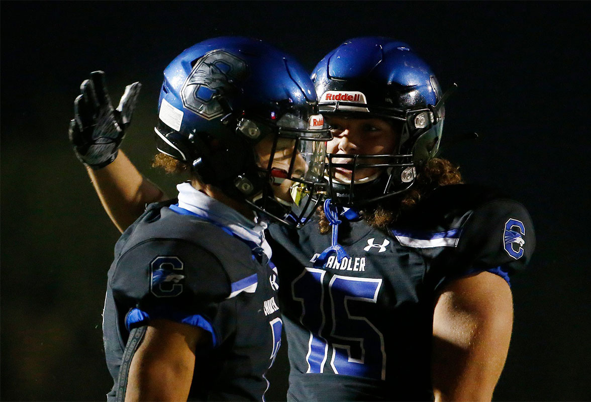 Chandler's Eli Swope (15) celebrates with Kyion Grayes (7) after Graves makes a catch against Hamilton during a game at Chandler High School