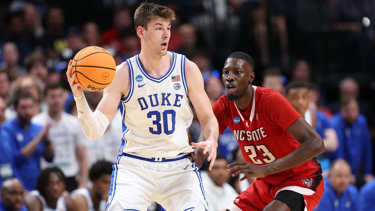 Duke Blue Devils center Kyle Filipowski (30) controls the ball against North Carolina State Wolfpack forward Mohamed Diarra (23) in the second half in the finals of the South Regional of the 2024 NCAA Tournament at American Airlines Center.