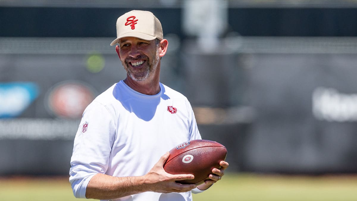 Kyle Shanahan of the 49ers with a football in practice. 