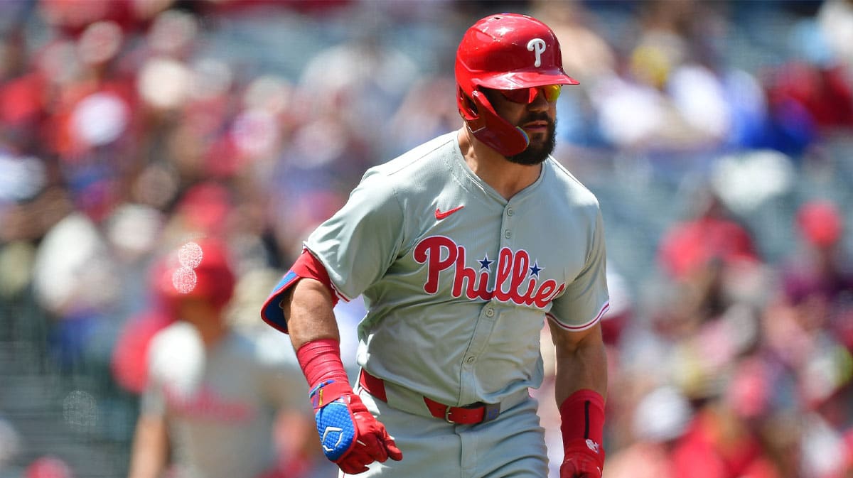 Philadelphia Phillies left fielder Kyle Schwarber (12) hits a two run RBI single against the Los Angeles Angels during the second inning at Angel Stadium.