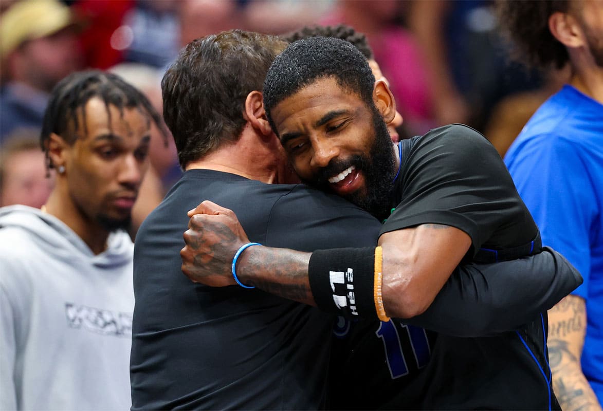 Dallas Mavericks guard Kyrie Irving (11) celebrates with Mark Cuban during the second half against the Phoenix Suns at American Airlines Center. 