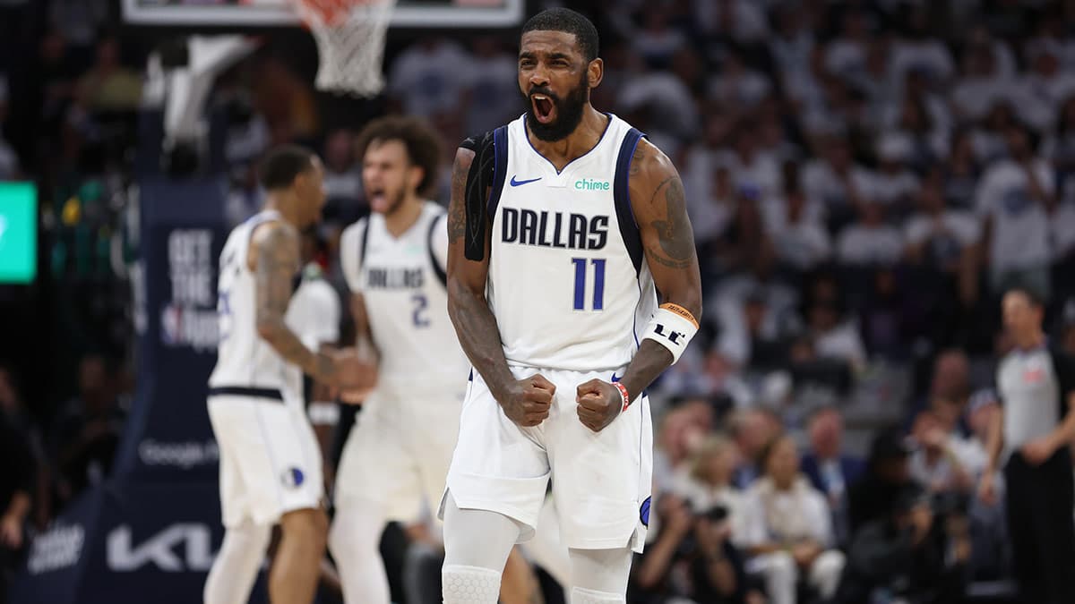 Minneapolis, Minnesota, USA; Dallas Mavericks guard Kyrie Irving (11) celebrates during the fourth quarter against the Minnesota Timberwolves in game five of the western conference finals for the 2024 NBA playoffs at Target Center.