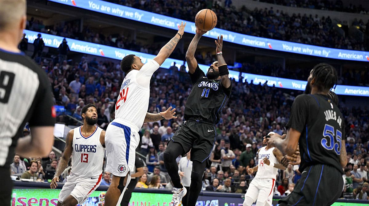 Dallas Mavericks guard Kyrie Irving (11) shoots the ball over LA Clippers guard Norman Powell (24) during the third quarter during game six of the first round for the 2024 NBA playoffs at American Airlines Center.