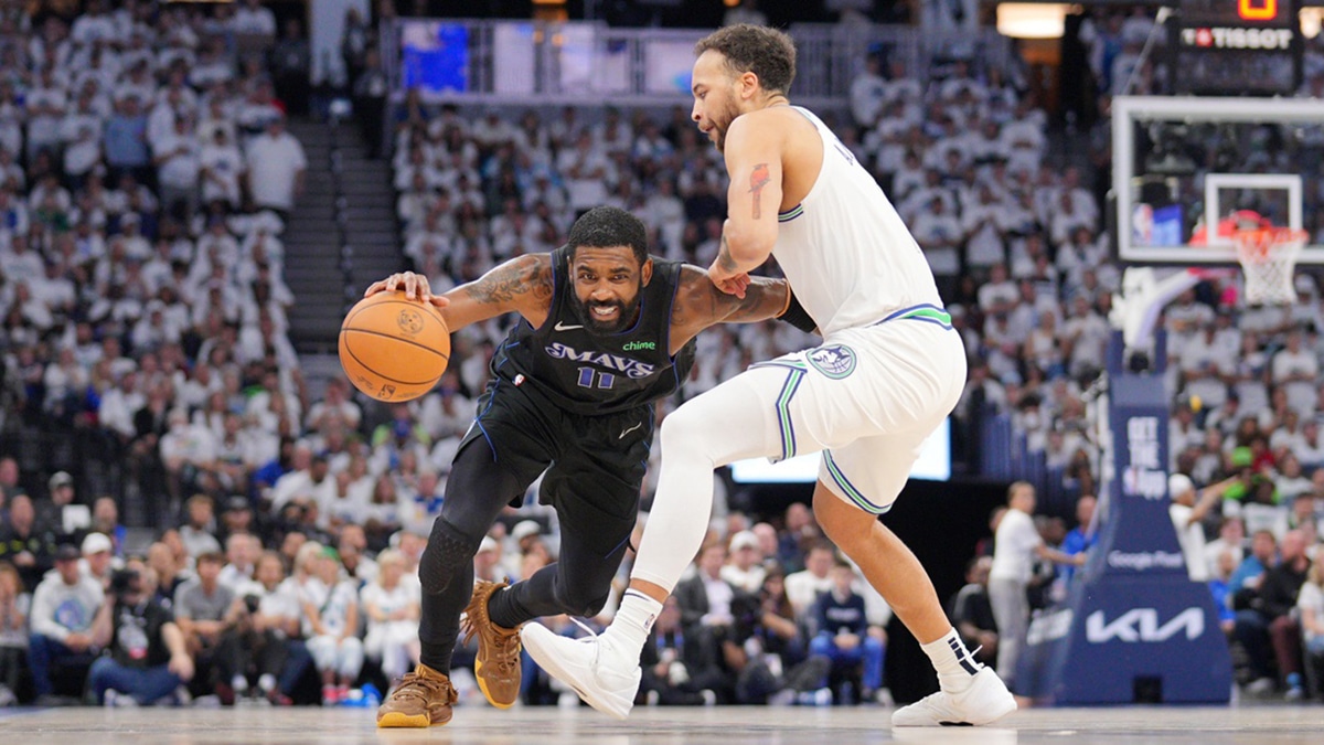 Minneapolis, Minnesota, USA; Dallas Mavericks guard Kyrie Irving (11) controls the ball against Minnesota Timberwolves forward Kyle Anderson (1) in the third quarter during game two of the western conference finals for the 2024 NBA playoffs at Target Center. Mandatory 