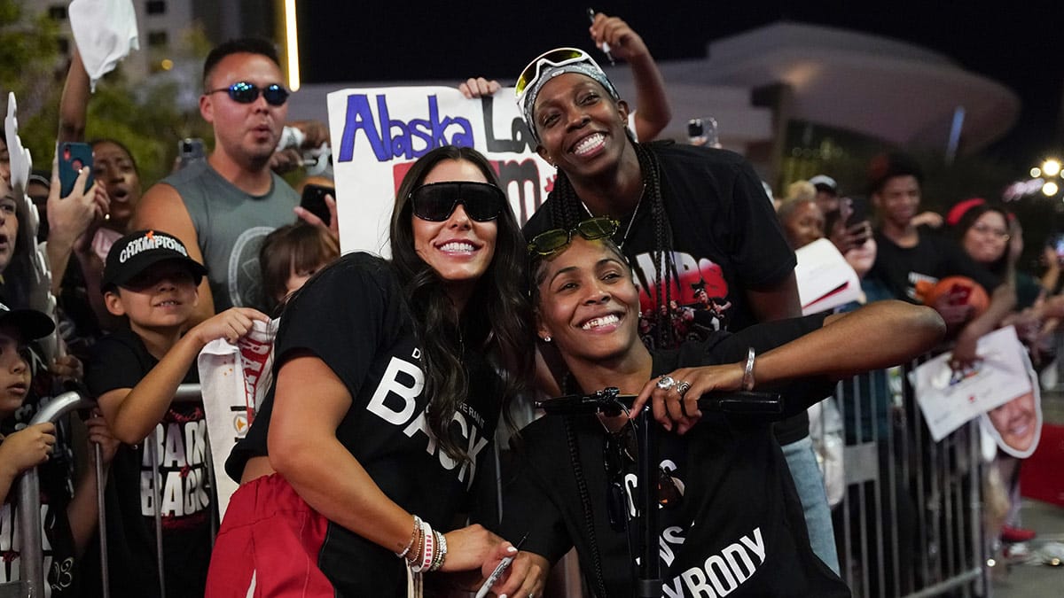 Las Vegas guards Kelsey Plum (10), Sydney Colson (51) and Chelsea Gray (12) pose for a photo op during the Las Vegas Aces championship parade.