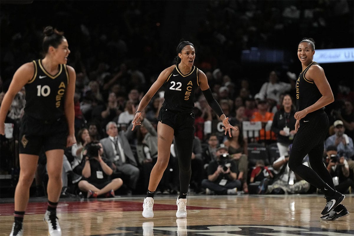 Las Vegas Aces guard Kelsey Plum (10), Las Vegas Aces center A'ja Wilson (22), and Las Vegas Aces center Kiah Stokes (41) celebrate a play during the second half of game one of the 2023 WNBA Playoffs at Michelob Ultra Arena.