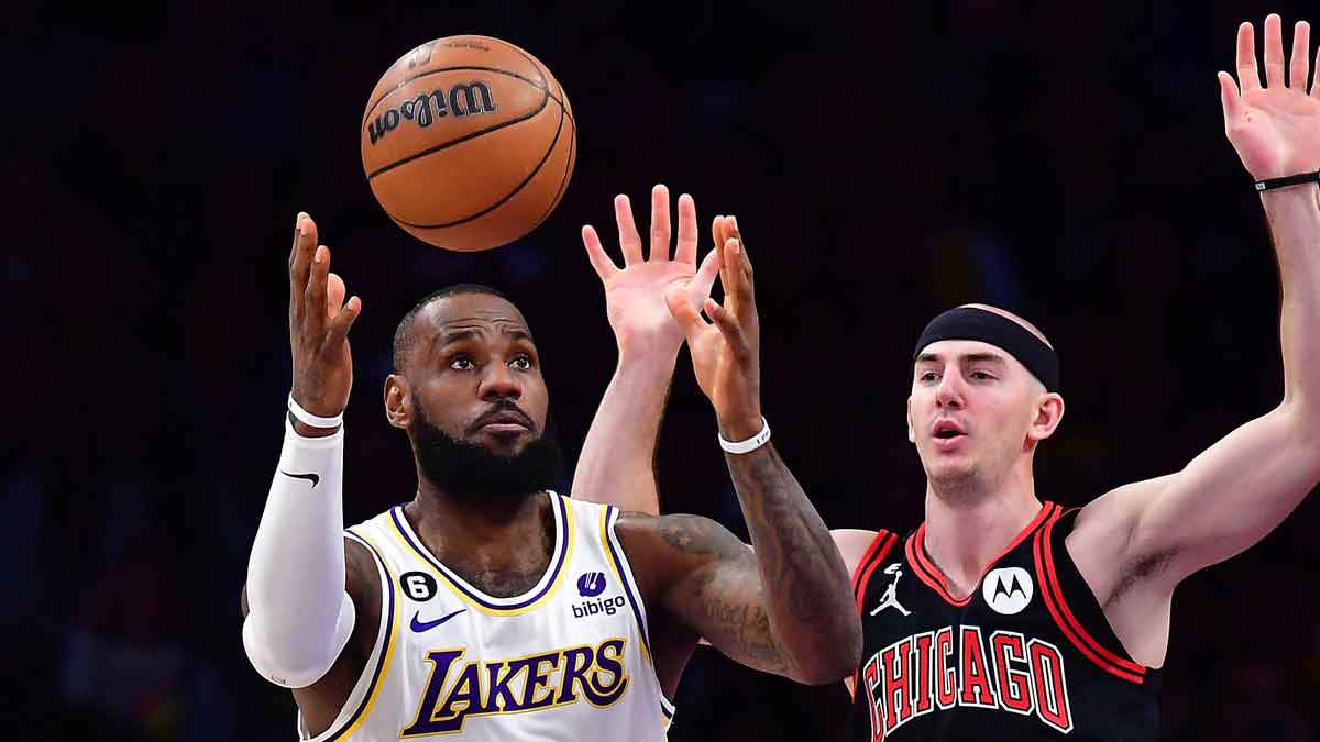 Los Angeles Lakers forward LeBron James (6) plays for the ball against Chicago Bulls guard Alex Caruso (6) uring the first half at Crypto.com Arena. 