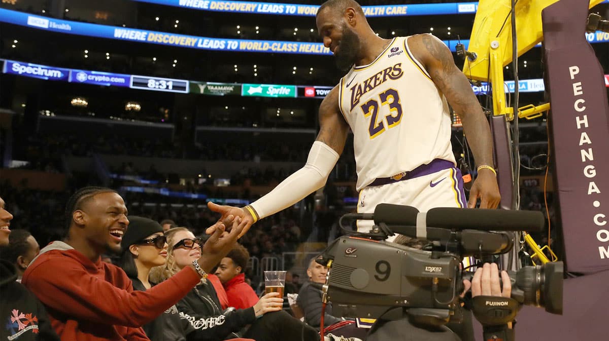 Los Angeles Lakers forward LeBron James (23) shakes hands with his son Bronny James during the second half against the Houston Rockets at Crypto.com Arena.