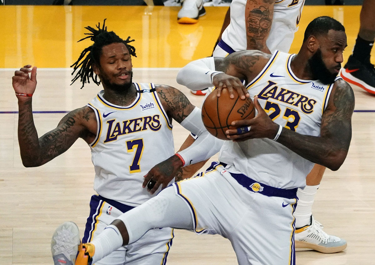 Los Angeles Lakers forward LeBron James (23) gets a rebound in front of guard Ben McLemore (7) against the Toronto Raptors during the second half at Staples Center.