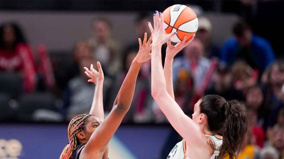 Indiana Fever forward Aliyah Boston (7) attempts to block a shot by New York Liberty forward Breanna Stewart (30) on Thursday, May 16, 2024, during the Indiana Fever home opener game against the New York Liberty at Gainbridge Fieldhouse in Indianapolis.