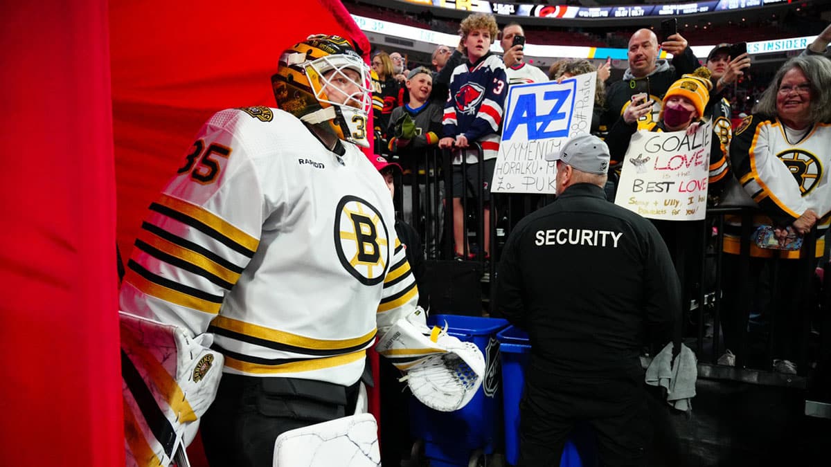 Boston Bruins goaltender Linus Ullmark (35) goes past the fans on his way to the warmups before the game against the Carolina Hurricanes at PNC Arena.