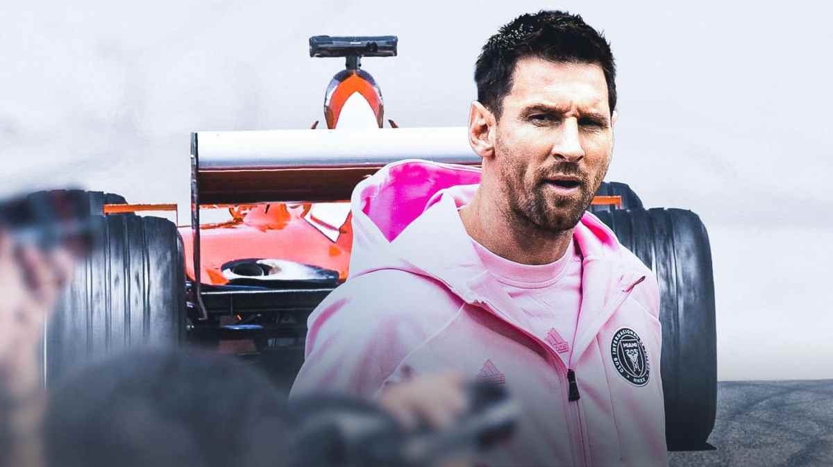 Lionel Messi smiling in front of an F1 car