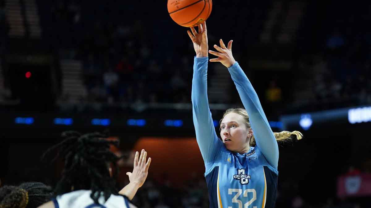 Marquette Golden Eagles forward Liza Karlen (32) shoots the ball against the UConn Huskies in the second half.
