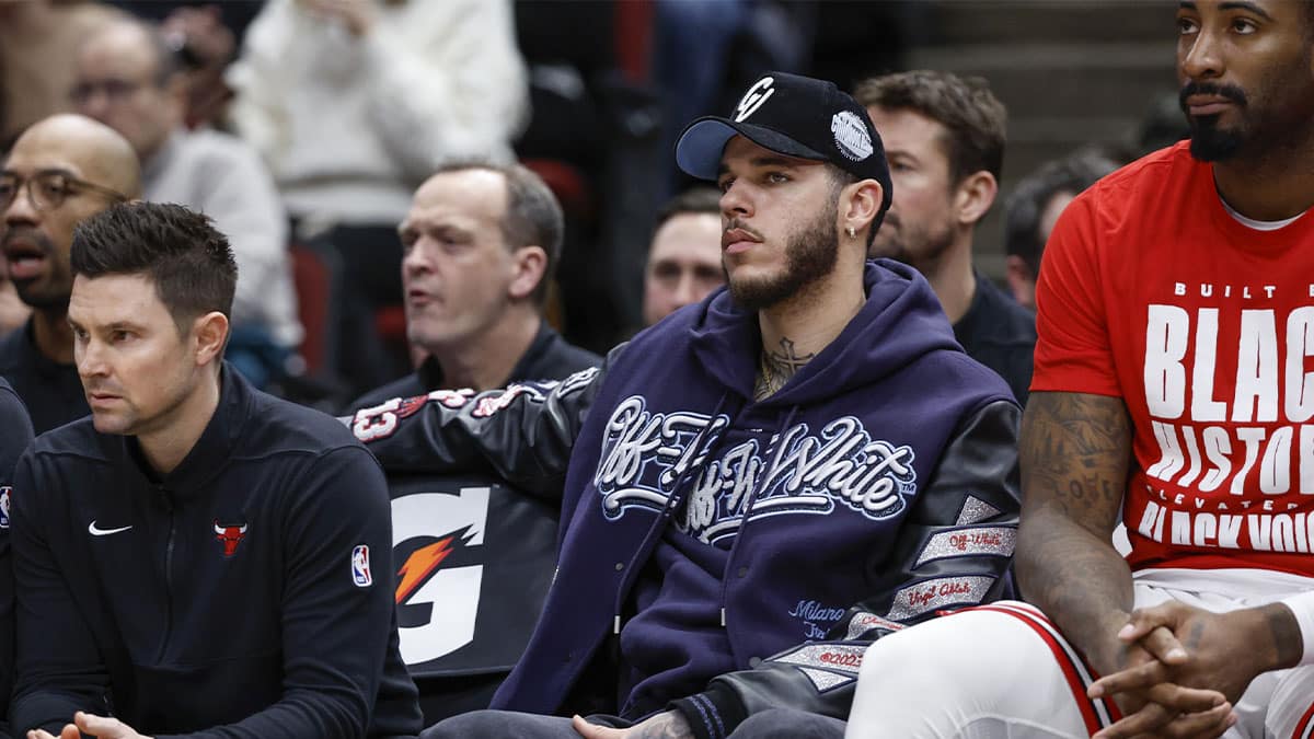 Injured Chicago Bulls guard Lonzo Ball (2) sits on the bench during the first half of a basketball game against the Sacramento Kings at United Center.