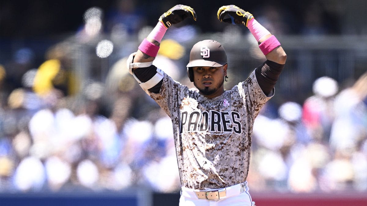 San Diego Padres designated hitter Luis Arraez (4) celebrates after hitting a double against the Los Angeles Dodgers during the second inning at Petco Park.
