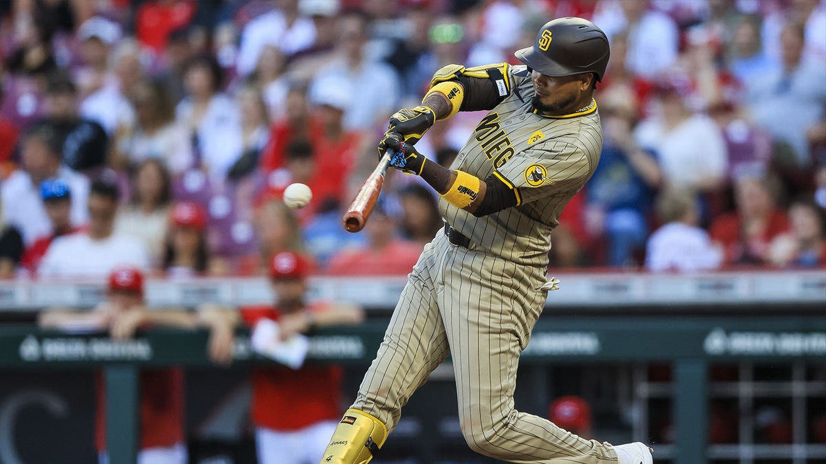 San Diego Padres second baseman Luis Arraez (4) hits a single against the Cincinnati Reds in the third inning at Great American Ball Park.