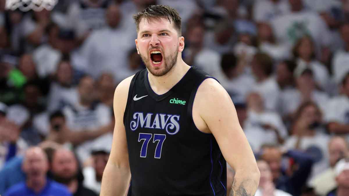Dallas Mavericks guard Luka Doncic (77) reacts in the fourth quarter against the Minnesota Timberwolves during game two of the western conference finals for the 2024 NBA playoffs at Target Center. 