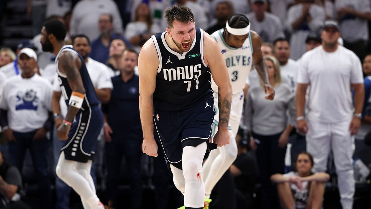 Dallas Mavericks guard Luka Doncic (77) celebrates after in the fourth quarter against the Minnesota Timberwolves in game one of the western conference finals for the 2024 NBA playoffs at Target Center