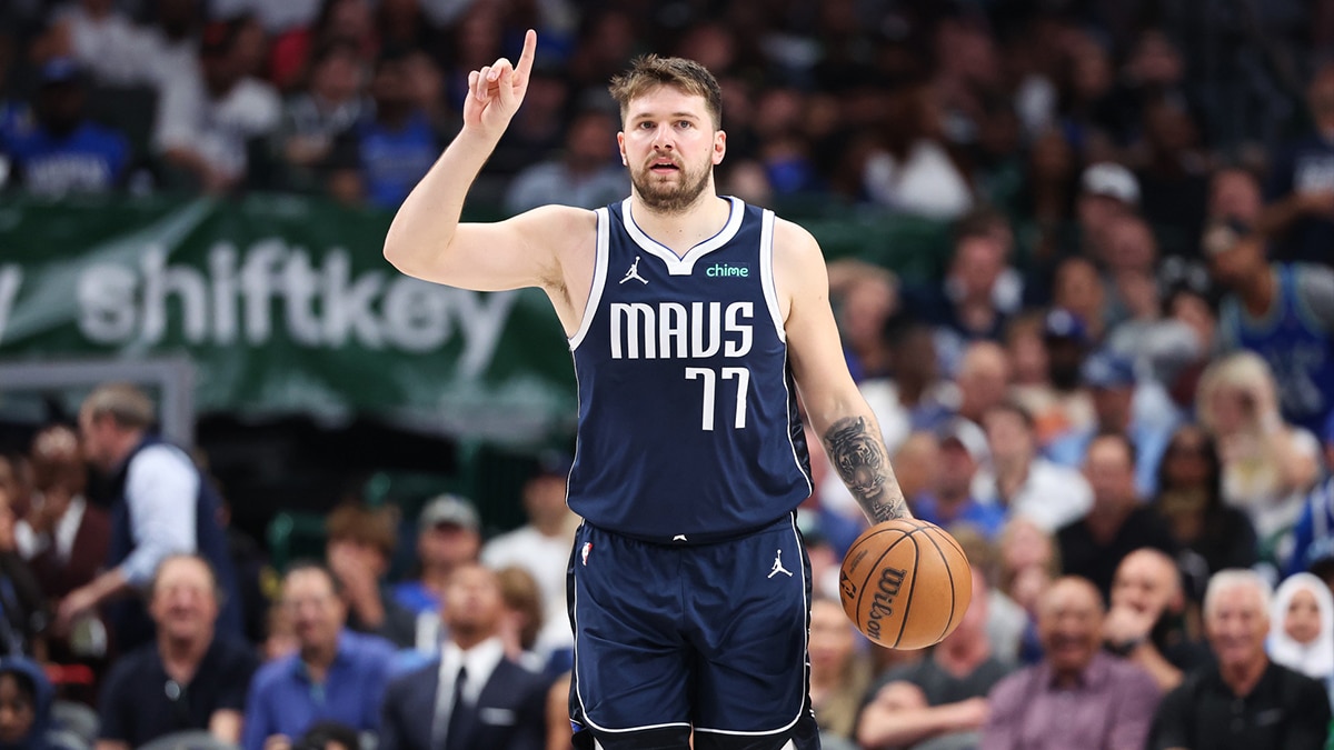 Dallas Mavericks guard Luka Doncic (77) gestures during the third quarter against the Minnesota Timberwolves in game four of the western conference finals for the 2024 NBA playoffs at American Airlines Center