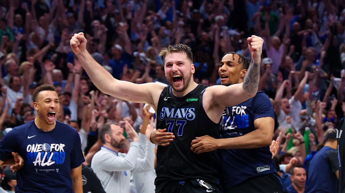 Dallas Mavericks guard Luka Doncic (77) celebrates with teammates after the game against the Oklahoma City Thunder in game six of the second round of the 2024 NBA playoffs at American Airlines Center.