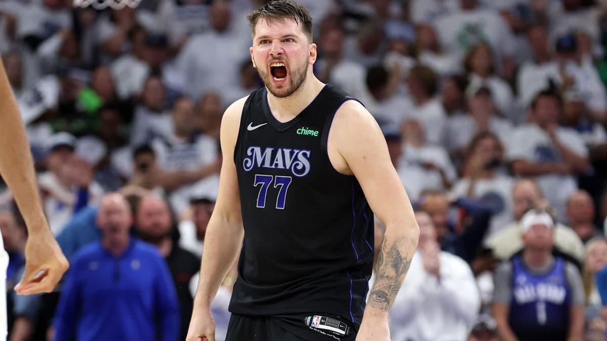 Dallas Mavericks guard Luka Doncic (77) reacts in the fourth quarter against the Minnesota Timberwolves during game two of the western conference finals for the 2024 NBA playoffs at Target Center.