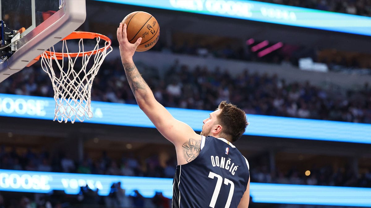 Dallas Mavericks guard Luka Doncic (77) shoots a layup against the Minnesota Timberwolves during the third quarter in game four of the western conference finals for the 2024 NBA playoffs at American Airlines Center. 