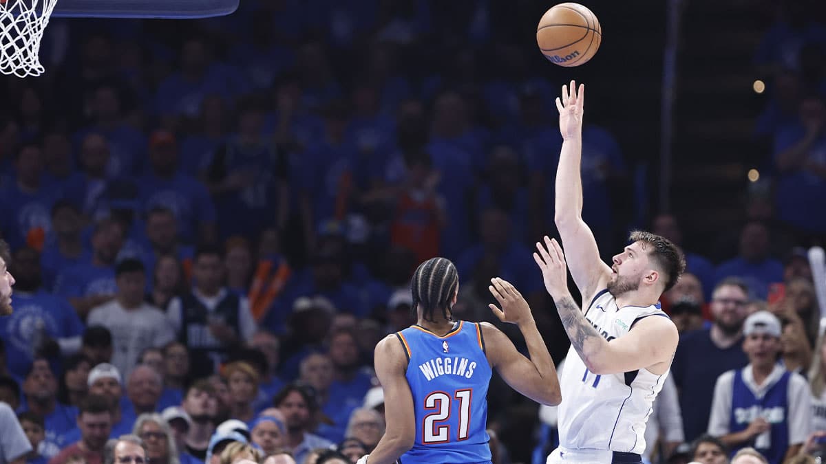 Dallas Mavericks guard Luka Doncic (77) shoots beside Oklahoma City Thunder guard Aaron Wiggins (21) during the second quarter of game two of the second round for the 2024 NBA playoffs at Paycom Center. 