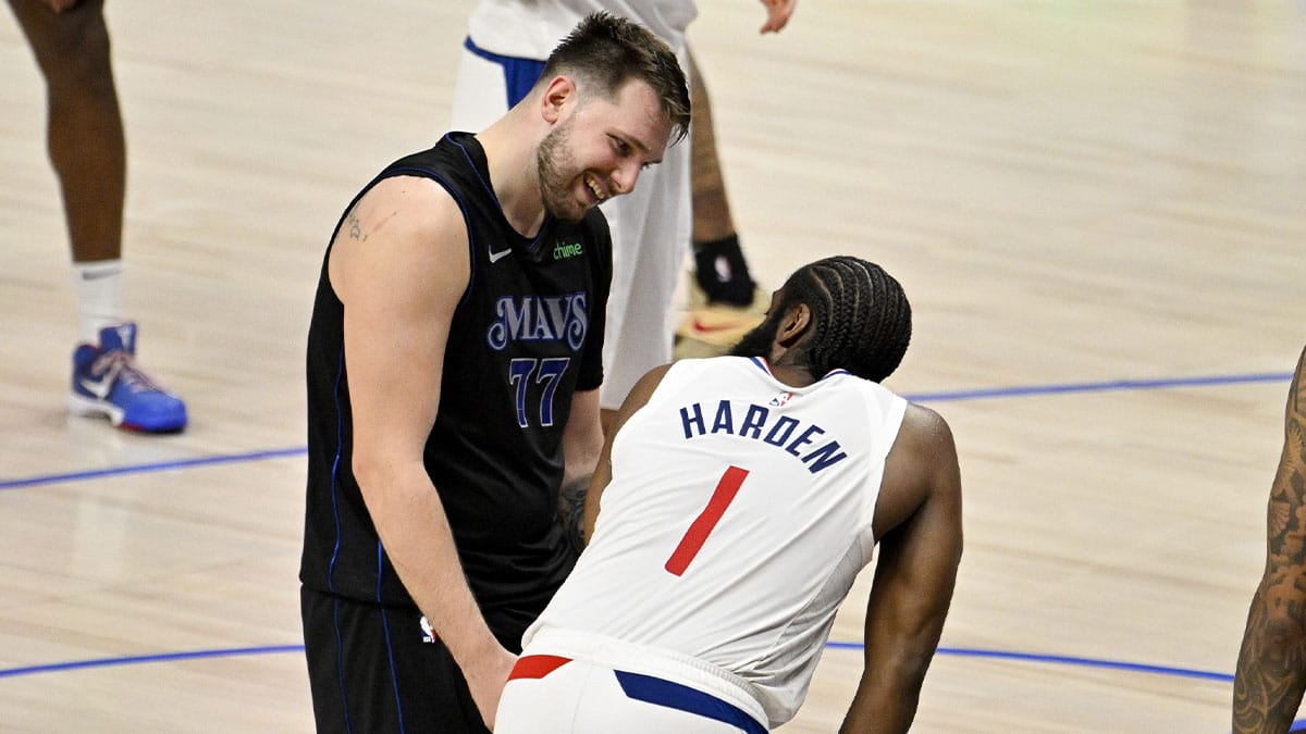 Dallas Mavericks guard Luka Doncic (77) jokes with LA Clippers guard James Harden (1) during the fourth quarter during game six of the first round for the 2024 NBA playoffs at American Airlines Center.