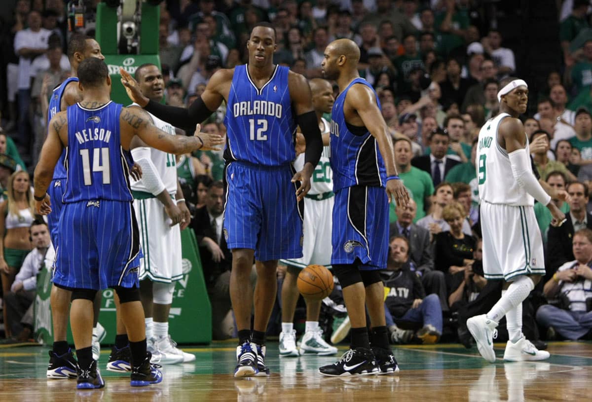 Orlando Magic center Dwight Howard (12) high fives guard Jameer Nelson (14) during overtime in game four of the eastern conference finals in the 2010 NBA playoffs against the Boston Celtics at TD Garden. The Magic won 96-92.
