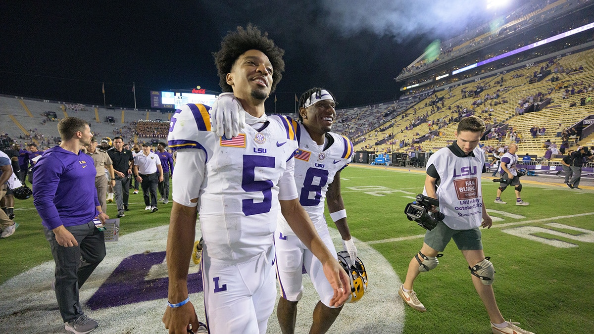 LSU Tigers quarterback Jayden Daniels (5) and wide receiver Malik Nabers (8) walk off the field after defeating the Army Black Knights at Tiger Stadium.