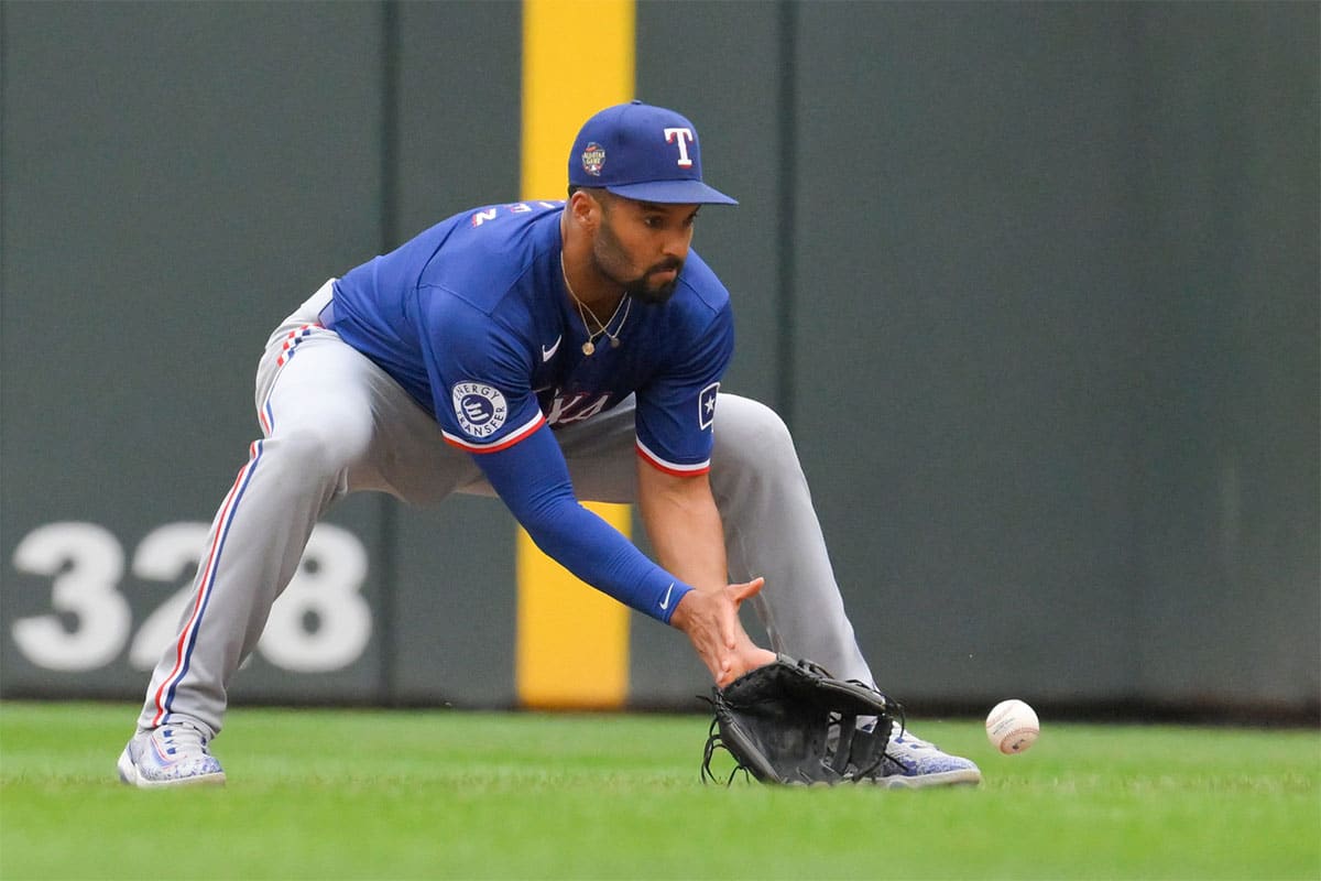 Texas Rangers infielder Marcus Semien (2) fields a ground ball against the Minnesota Twins during the third inning at Target Field.